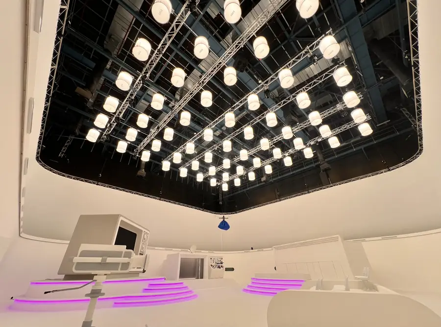 Grid of soft LED panels lit above a white studio set