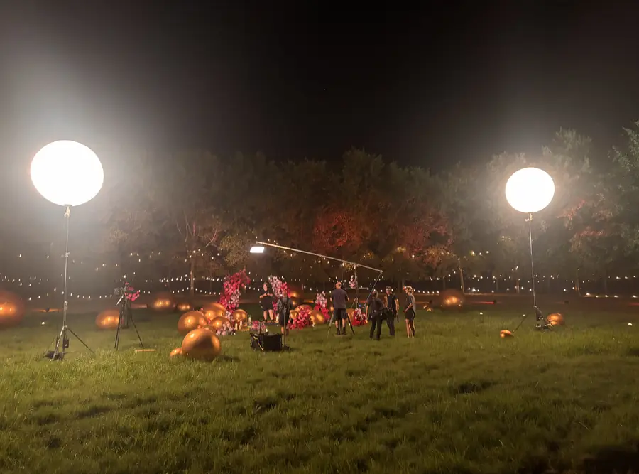 Balloon lights over a night-time field location shoot